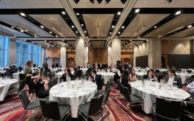 a group of people sitting at tables