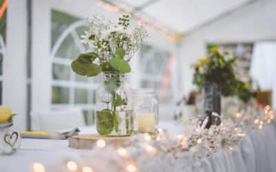 white flowers in clear glass vase on table